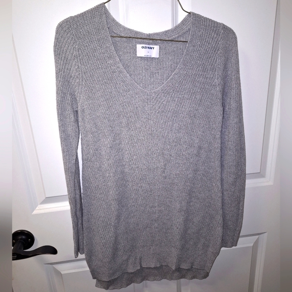 An Old Navy grey cable knit V-neck sweater in a ladies XS.